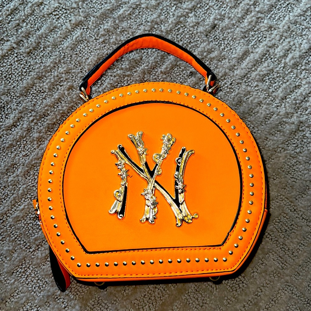 Vibrant Orange Mini Bag with Gold Detailing